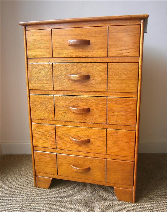 A Heals style golden oak five drawer chest W.56cm